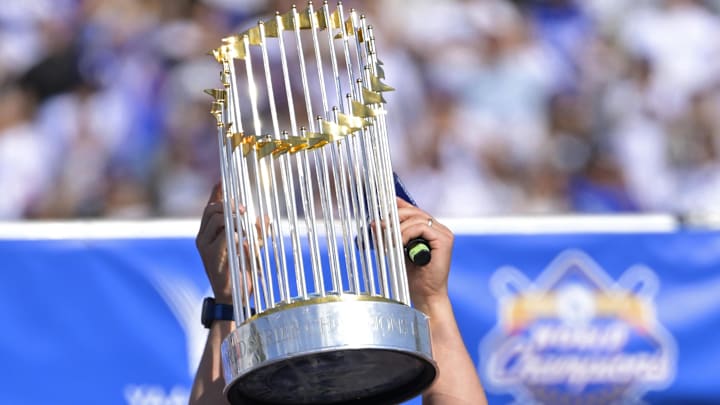 Nov 1, 2024; Los Angeles, CA, USA; Los Angeles Dodgers starting pitcher Clayton Kershaw (22) lifts the Commissioner's Trophy during the team's 2024 World Series celebration at Dodger Stadium. Mandatory Credit: Jayne Kamin-Oncea-Imagn Images Nov 1, 2024; Los Angeles, CA, USA; Los Angeles Dodgers starting pitcher Clayton Kershaw (22) lifts the Commissioner's Trophy during the team's 2024 World Series celebration at Dodger Stadium. Mandatory Credit: Jayne Kamin-Oncea-Imagn Images