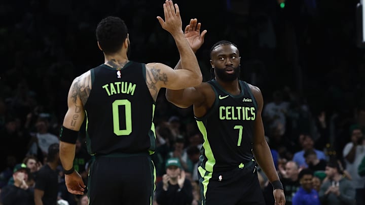 Feb 28, 2025; Boston, Massachusetts, USA; Boston Celtics guard Jaylen Brown (7) high fives forward Jayson Tatum (0) after the Cleveland Cavaliers called a timeout during the first quarter at TD Garden. Mandatory Credit: Winslow Townson-Imagn Images