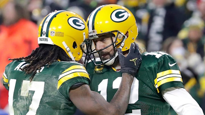 Green Bay Packers wide receiver Davante Adams (17) and quarterback Aaron Rodgers (12) celebrate a second quarter touchdown against the Cleveland Browns during their football game on Saturday December 25, 2021, at Lambeau Field in Green Bay, Wis.