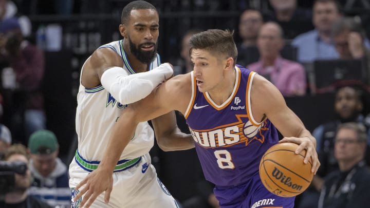 Apr 20, 2024; Minneapolis, Minnesota, USA; Phoenix Suns guard Grayson Allen (8) drives to the basket