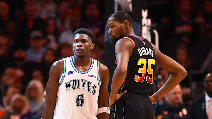 Nov 15, 2023; Phoenix, Arizona, USA; Minnesota Timberwolves guard Anthony Edwards (5) against Phoenix Suns forward Kevin Durant (35) at Footprint Center. Mandatory Credit: Mark J. Rebilas-Imagn Images