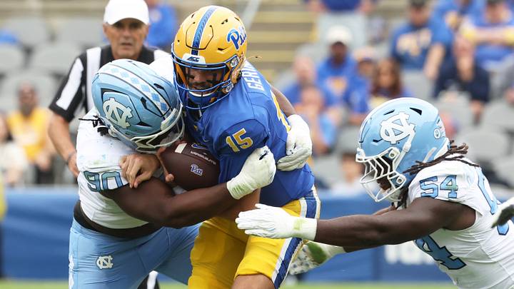 Oct 10, 2026; Pittsburgh, Pennsylvania, USA;  North Carolina Tar Heels defensive lineman Xavier Lewis (90)  and linebacker Timir Hickman-Collins (54) sack Pittsburgh Panthers quarterback Holden Geriner (15) during the second quarter at Acrisure Stadium.  Mandatory Credit: Charles LeClaire-Imagn Images