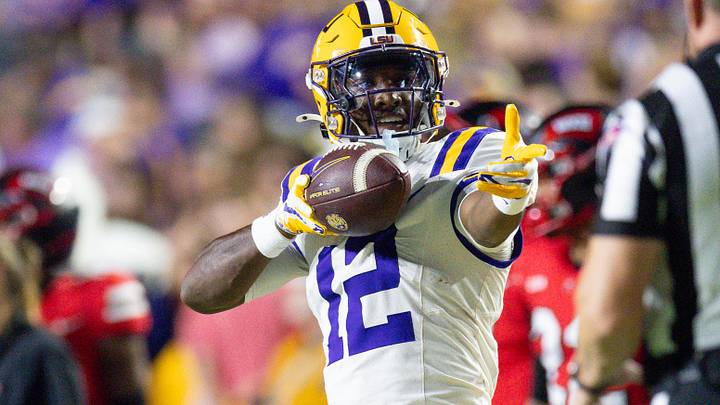 LSU Tigers wide receiver Kyle Parker (12) reacts to making a first down against Western Kentucky Hilltoppers defensive back Nazir Ward (not pictured) during the first half at Tiger Stadium. LSU Tigers wide receiver Kyle Parker (12) reacts to making a first down against Western Kentucky Hilltoppers defensive back Nazir Ward (not pictured) during the first half at Tiger Stadium.