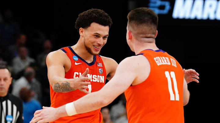 Clemson Tigers guard Joseph Girard III celebrates with guard Chase Hunter