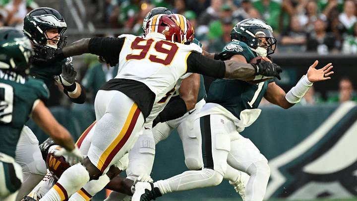 Sep 13, 2026; Philadelphia, Pennsylvania, USA;  Washington Commanders DT Javon Kinlaw (99) sacks Philadelphia Eagles QB Jalen Hurts (1) during the 2nd half at Lincoln Financial Field.  Mandatory Credit: Eric Hartline
