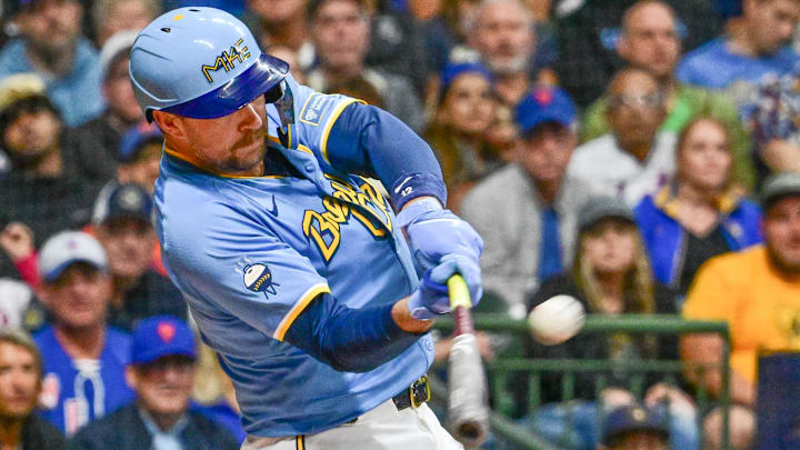 Sep 27, 2024; Milwaukee, Wisconsin, USA;  Milwaukee Brewers first baseman Rhys Hoskins (12) hits a grand slam home run against the New York Mets in the first inning at American Family Field. Mandatory Credit: Benny Sieu-Imagn Images
