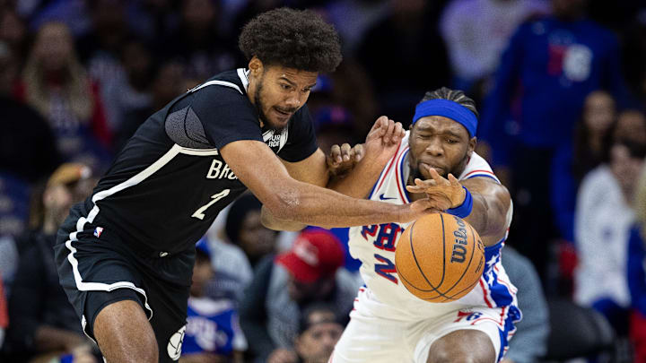 Oct 16, 2024; Philadelphia, Pennsylvania, USA; Brooklyn Nets Ziaire Williams (1) and Philadelphia 76ers forward Guerschon Yabusele (28) battle for a loose ball during the second quarter at Wells Fargo Center. Mandatory Credit: Bill Streicher-Imagn Images