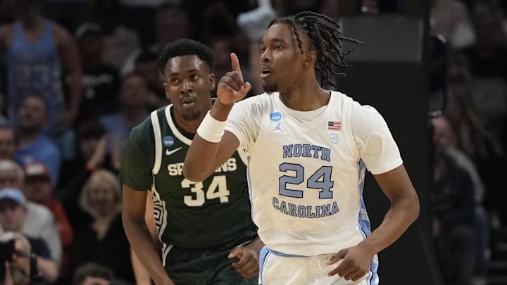 March 23, 2024, Charlotte, NC, USA; North Carolina Tar Heels forward Jae'Lyn Withers (24) reacts