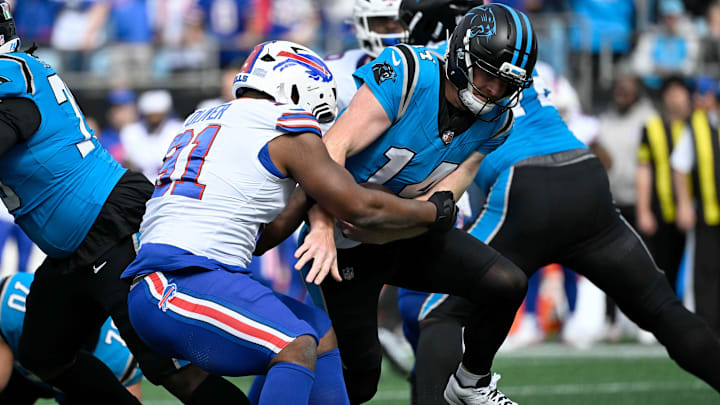Oct 26, 2025; Charlotte, North Carolina, USA; Buffalo Bills defensive tackle Ed Oliver (91) sacks Carolina Panthers quarterback Andy Dalton (14) during the first half at Bank of America Stadium. Oct 26, 2025; Charlotte, North Carolina, USA; Buffalo Bills defensive tackle Ed Oliver (91) sacks Carolina Panthers quarterback Andy Dalton (14) during the first half at Bank of America Stadium.