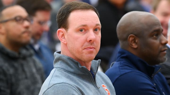 Mar 10, 2023; Syracuse, New York, USA; Syracuse Orange assistant coach Gerry McNamara (left) looks on prior to a press conference at the Carmelo K. Anthony Basketball Center. Mandatory Credit: Rich Barnes-Imagn Images Mar 10, 2023; Syracuse, New York, USA; Syracuse Orange assistant coach Gerry McNamara (left) looks on prior to a press conference at the Carmelo K. Anthony Basketball Center. Mandatory Credit: Rich Barnes-Imagn Images