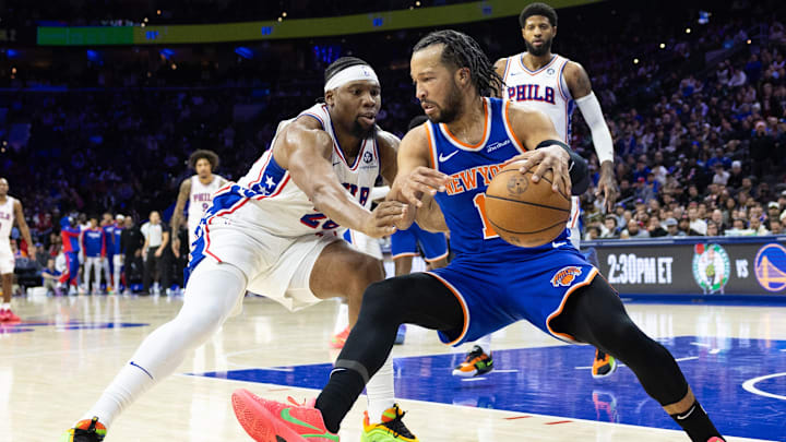 Jan 15, 2025; Philadelphia, Pennsylvania, USA; New York Knicks guard Jalen Brunson (11) controls the ball against Philadelphia 76ers forward Guerschon Yabusele (28) during the fourth quarter at Wells Fargo Center. Mandatory Credit: Bill Streicher-Imagn Images