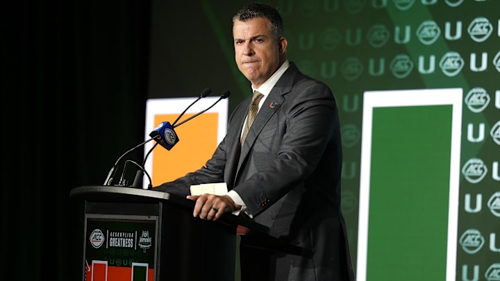 Jul 22, 2025; Charlotte, NC, USA; Miami head coach Mario Cristoba answers questions from the media during ACC Media Days at Hilton Charlotte Uptown. Mandatory Credit: Jim Dedmon-Imagn Images