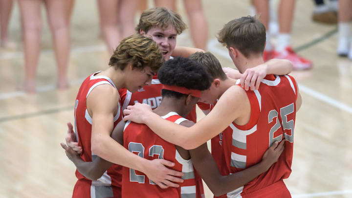 The Morton Potters starters huddle up before facing Metamora in the first half of their Mid-Illlini Conference basketball game Friday, Dec. 13, 2024 at the Shirk Center in Bloomington. The Redbirds defeated the Potters 52-46.