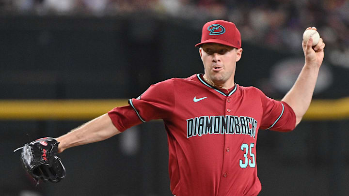 Joe Mantiply throws against the Brewers.