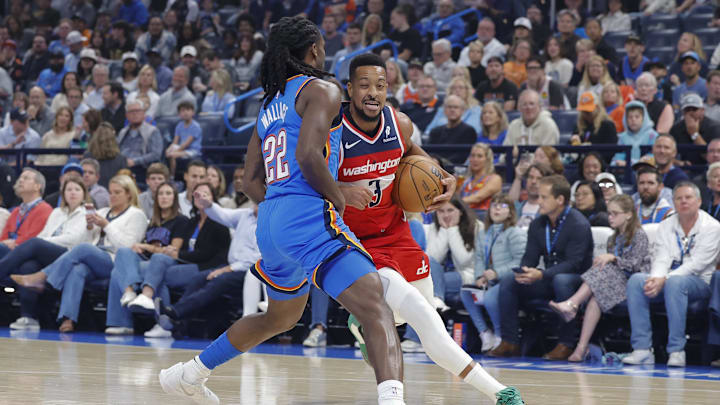 Oct 30, 2025; Oklahoma City, Oklahoma, USA; Washington Wizards guard CJ McCollum (3) drives against Oklahoma City Thunder guard Cason Wallace (22) during the first quarter at Paycom Center.