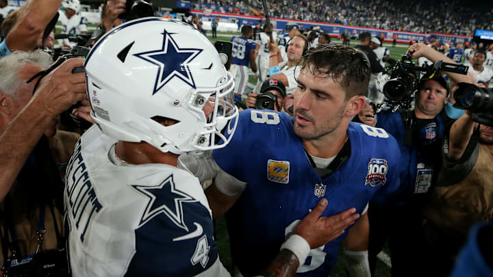 Sep 26, 2024; East Rutherford, New Jersey, USA; Dallas Cowboys quarterback Dak Prescott (4) and New York Giants quarterback Daniel Jones (8) meet after their game at MetLife Stadium. 