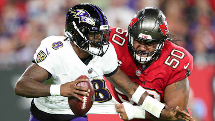 Oct 27, 2022; Tampa, Florida, USA;  Baltimore Ravens quarterback Lamar Jackson (8) is sacked by Tampa Bay Buccaneers defensive tackle Vita Vea (50) in the first quarter at Raymond James Stadium. Mandatory Credit: Nathan Ray Seebeck-Imagn Images