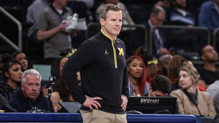 Dec 10, 2024; New York, New York, USA; Michigan Wolverines head coach Dusty May watches from the sidelines in the second half against the Arkansas Razorbacks at Madison Square Garden.