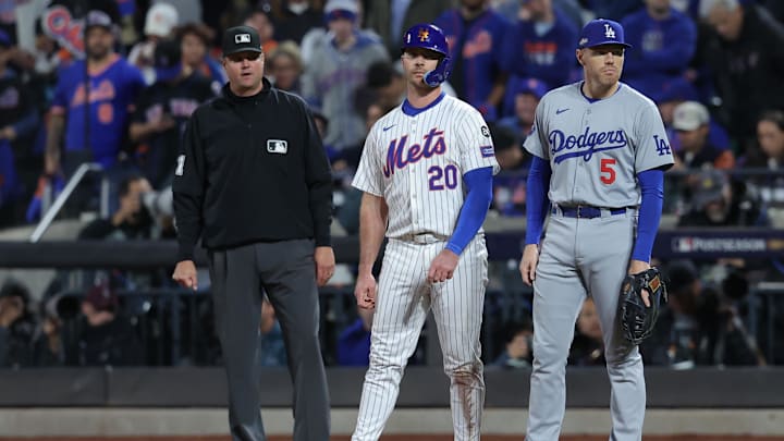 Oct 18, 2024; New York City, New York, USA; New York Mets first base Pete Alonso (20) reacts at first base with Los Angeles Dodgers first base Freddie Freeman (5) in the eighth inning during game five of the NLCS for the 2024 MLB playoffs at Citi Field. Mandatory Credit: Brad Penner-Imagn Images Oct 18, 2024; New York City, New York, USA; New York Mets first base Pete Alonso (20) reacts at first base with Los Angeles Dodgers first base Freddie Freeman (5) in the eighth inning during game five of the NLCS for the 2024 MLB playoffs at Citi Field. Mandatory Credit: Brad Penner-Imagn Images