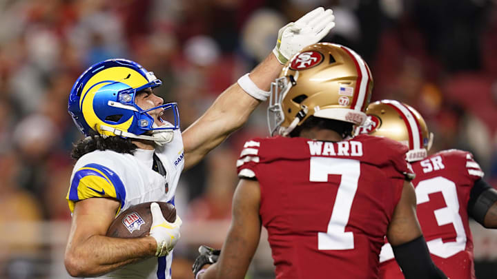 Dec 12, 2024; Santa Clara, California, USA; Los Angeles Rams wide receiver Puka Nacua (17) reacts after making a catch for a first down next to San Francisco 49ers cornerback Charvarius Ward (7) in the fourth quarter at Levi's Stadium. Mandatory Credit: Cary Edmondson-Imagn Images
