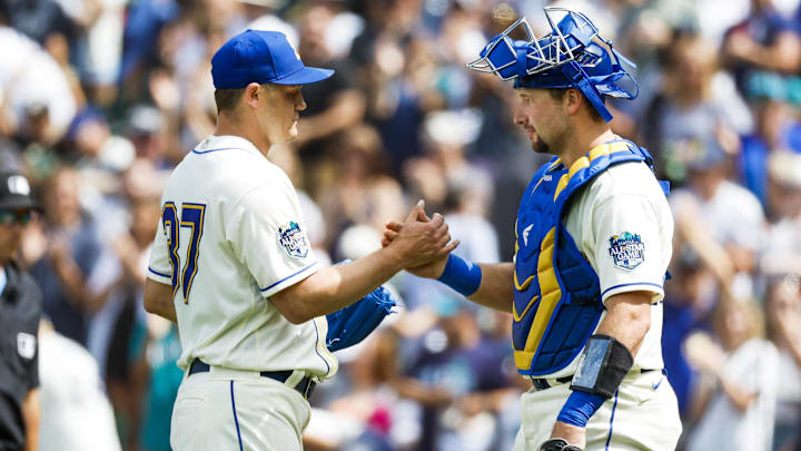 Seattle Mariners reliever Paul Sewald (left) and catcher Cal Raleigh shake hands after a win against the Detroit Tigers on July 16, 2023, at T-Mobile Park. Seattle Mariners reliever Paul Sewald (left) and catcher Cal Raleigh shake hands after a win against the Detroit Tigers on July 16, 2023, at T-Mobile Park.