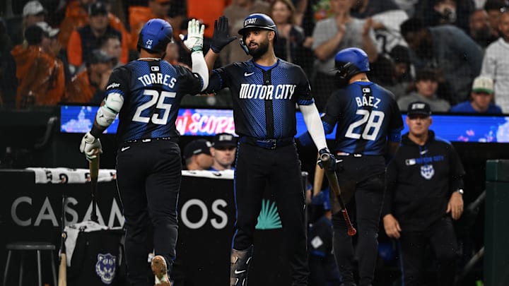 Jun 13, 2025; Detroit, Michigan, USA; Detroit Tigers second base Gleyber Torres (25) celebrates with left fielder Riley Greene (31) after driving in a run with a sacrifice fly against the Cincinnati Reds in the sixth inning at Comerica Park. Mandatory Credit: Lon Horwedel-Imagn Images