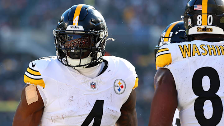 Nov 23, 2025; Chicago, Illinois, USA; Pittsburgh Steelers wide receiver DK Metcalf (4) reacts after a touchdown against the Chicago Bears during the first half at Soldier Field. Mandatory Credit: Mike Dinovo-Imagn Images