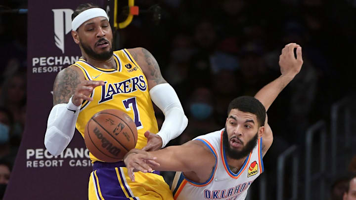 Nov 4, 2021; Los Angeles, California, USA; Los Angeles Lakers forward Carmelo Anthony (7) battles Oklahoma City Thunder forward Kenrich Williams (34) for a rebound in the second half at Staples Center. Mandatory Credit: Jayne Kamin-Oncea-Imagn Images