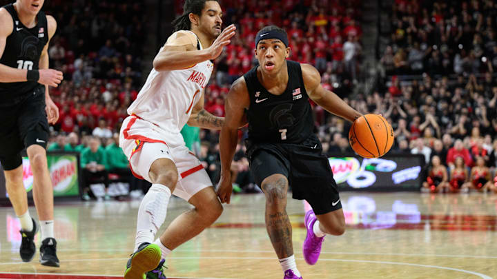 Feb 26, 2025; College Park, Maryland, USA; Michigan State Spartans guard Jeremy Fears Jr. (1) drives to the basket against Maryland Terrapins guard Rodney Rice (1) during the first half at Xfinity Center. Mandatory Credit: Reggie Hildred-Imagn Images