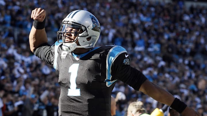 Jan 12, 2014; Charlotte, NC, USA; Carolina Panthers quarterback Cam Newton (1) celebrates a passing touchdown against the San Francisco 49ers during the first half of the 2013 NFC divisional playoff football game at Bank of America Stadium. Mandatory Credit: Jeremy Brevard-Imagn Images