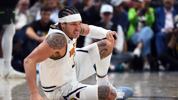 Apr 18, 2026; Denver, Colorado, USA; Denver Nuggets forward Aaron Gordon (32) on the floor after a play during the second half against the Minnesota Timberwolves in game one of the first round of the 2026 NBA Playoffs at Ball Arena. Mandatory Credit: Christopher Hanewinckel-Imagn Images