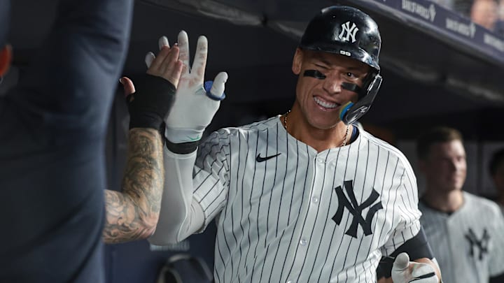 Aug 23, 2024; Bronx, New York, USA; New York Yankees center fielder Aaron Judge (99) celebrates his solo home run with teammates during the sixth inning against the Colorado Rockies at Yankee Stadium. Mandatory Credit: Vincent Carchietta-USA TODAY Sports