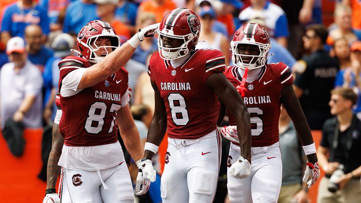 Oct 10, 2026; Gainesville, Florida, USA; South Carolina Gamecocks wide receiver Nyck Harbor (8) celebrates a touchdown with tight end Brady Hunt (87) and wide receiver Donovan Murph (6) against the Florida Gators during the first half at Ben Hill Griffin Stadium. Mandatory Credit: Matt Pendleton-Imagn Images Oct 10, 2026; Gainesville, Florida, USA; South Carolina Gamecocks wide receiver Nyck Harbor (8) celebrates a touchdown with tight end Brady Hunt (87) and wide receiver Donovan Murph (6) against the Florida Gators during the first half at Ben Hill Griffin Stadium. Mandatory Credit: Matt Pendleton-Imagn Images
