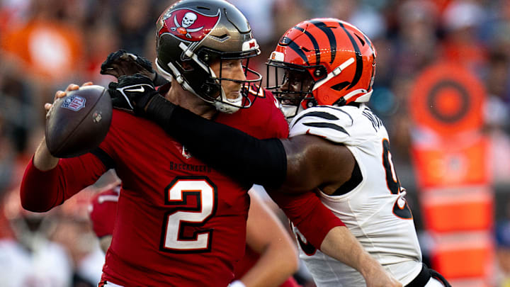 Cincinnati Bengals defensive end Myles Murphy (99) hits Tampa Bay Buccaneers quarterback Kyle Trask (2) causing an incomplete pass in the second quarter of the NFL preseason game at Paycor Stadium in Cincinnati on Saturday, August 10, 2024.