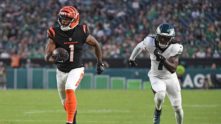 Aug 7, 2025; Philadelphia, Pennsylvania, USA; Cincinnati Bengals wide receiver Ja'Marr Chase (1) runs past Philadelphia Eagles cornerback Kelee Ringo (7) on a 36-yard touchdown catch during the first quarter against the Philadelphia Eagles at Lincoln Financial Field. Mandatory Credit: Eric Hartline-Imagn Images