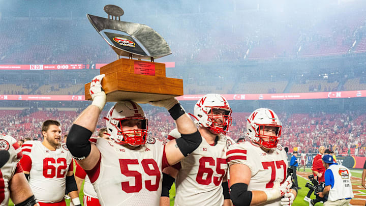 Nebraska offensive lineman Henry Lutovsky hoists the Kansas City Classic trophy after the Huskers' 20-17 win Thursday night over Cincinnati. Nebraska offensive lineman Henry Lutovsky hoists the Kansas City Classic trophy after the Huskers' 20-17 win Thursday night over Cincinnati.