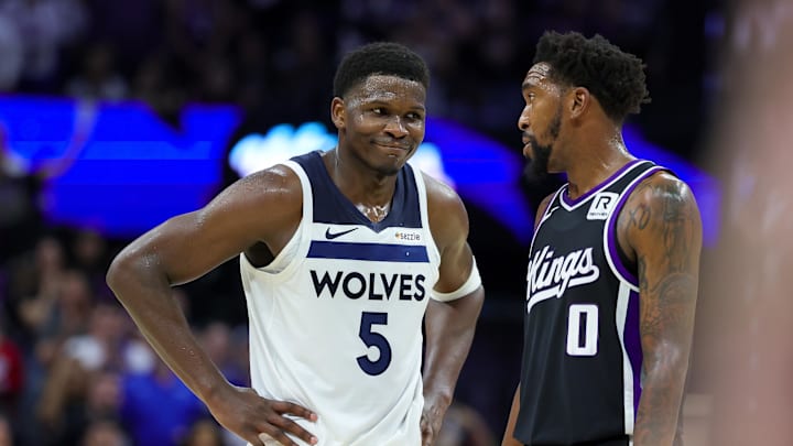 Oct 24, 2024; Sacramento, California, USA; Minnesota Timberwolves guard Anthony Edwards (5) talks with Sacramento Kings guard Malik Monk (0) during the fourth quarter at Golden 1 Center. Mandatory Credit: Sergio Estrada-Imagn Images