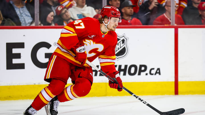 Feb 23, 2025; Calgary, Alberta, CAN; Calgary Flames center Connor Zary (47) skates against the San Jose Sharks during the third period at Scotiabank Saddledome. Mandatory Credit: Sergei Belski-Imagn Images