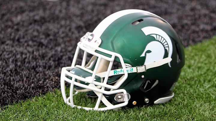 Sep 4, 2015; Kalamazoo, MI, USA; General view of Michigan State Spartans helmet on field prior to a game against Western Michigan at Waldo Stadium. Mandatory Credit: Mike Carter-USA TODAY Sports