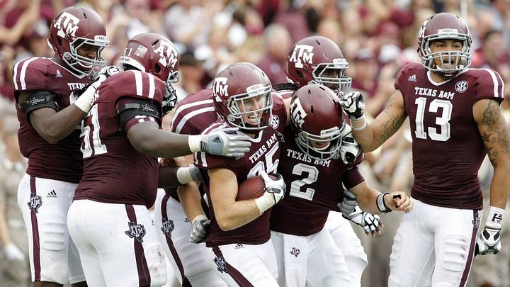 Texas A&M Aggies wide receiver Ryan Swope (25) celebrates a touchdown catch with quarterback Johnny Manziel (2) and teammates against the Arkansas Razorbacks in the second quarter at Kyle Field. Texas A&M Aggies wide receiver Ryan Swope (25) celebrates a touchdown catch with quarterback Johnny Manziel (2) and teammates against the Arkansas Razorbacks in the second quarter at Kyle Field.