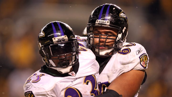 Baltimore Ravens running back Willis McGahee celebrates with center Jason Brown during a game against the Pittsburgh Steelers.