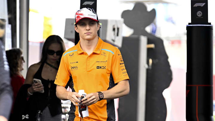 Oct 18, 2024; Austin, Texas, USA; McLaren Formula 1 Team driver Oscar Piastri (81) of Team Australia walks through the track entrance before practice for the 2024 US Grand Prix at Circuit of the Americas. Mandatory Credit: Jerome Miron-Imagn Images