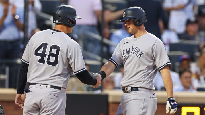 Jun 13, 2023; New York City, New York, USA; New York Yankees third baseman DJ LeMahieu (26) shakes hands with first baseman Anthony Rizzo (48) during the fourth inning against the New York Mets at Citi Field. Mandatory Credit: Vincent Carchietta-USA TODAY Sports