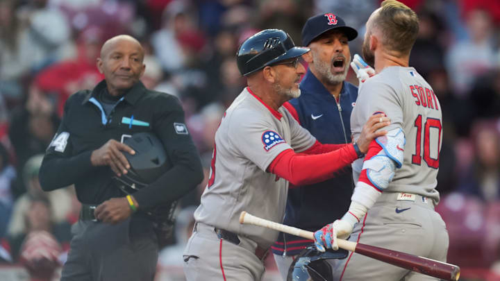 Boston Red Sox shortstop Trevor Story exchanges words with umpire CB Bucknor. Boston Red Sox shortstop Trevor Story exchanges words with umpire CB Bucknor.