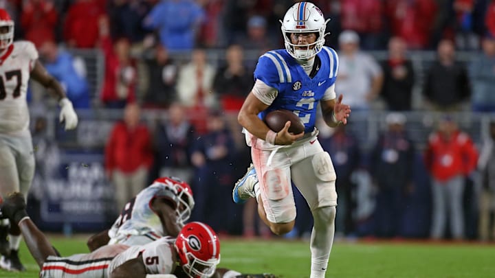 Nov 9, 2024; Oxford, Mississippi, USA; Mississippi Rebels quarterback Jaxson Dart (2) runs the ball during the second half against the Georgia Bulldogs at Vaught-Hemingway Stadium. Mandatory Credit: Petre Thomas-Imagn Images Nov 9, 2024; Oxford, Mississippi, USA; Mississippi Rebels quarterback Jaxson Dart (2) runs the ball during the second half against the Georgia Bulldogs at Vaught-Hemingway Stadium. Mandatory Credit: Petre Thomas-Imagn Images
