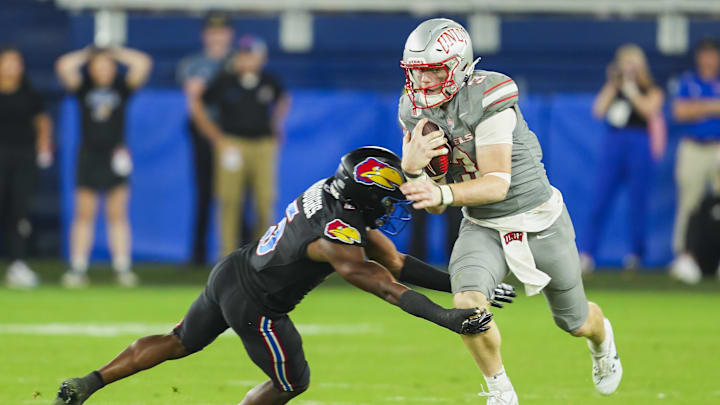 Sluka runs the ball against the Kansas Jayhawks.