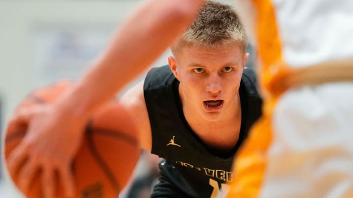 Mt. Vernon Marauders guard Luke Ertel (12) watches the ball 