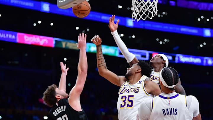 Dec 2, 2023; Los Angeles, California, USA; Los Angeles Lakers forward Christian Wood (35) and forward Jarred Vanderbilt (2) play for the rebound against Houston Rockets center Alperen Sengun (28) during the first half at Crypto.com Arena. Mandatory Credit: Gary A. Vasquez-Imagn Images Dec 2, 2023; Los Angeles, California, USA; Los Angeles Lakers forward Christian Wood (35) and forward Jarred Vanderbilt (2) play for the rebound against Houston Rockets center Alperen Sengun (28) during the first half at Crypto.com Arena. Mandatory Credit: Gary A. Vasquez-Imagn Images