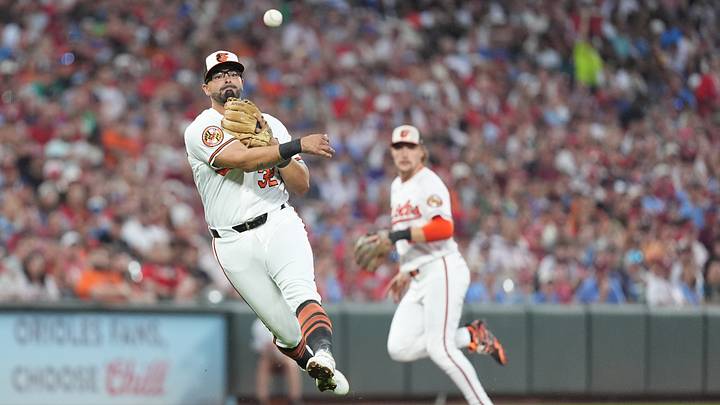 Aug 1, 2026; Baltimore, Maryland, USA; Baltimore Orioles third baseman Christian Encarnacion-Strand (32) leaps and throws to first base for an out against Philadelphia Phillies third baseman Alec Bohm (not pictured) during the fourth inning at Oriole Park at Camden Yards. Mandatory Credit: Gregory Fisher-Imagn Images
