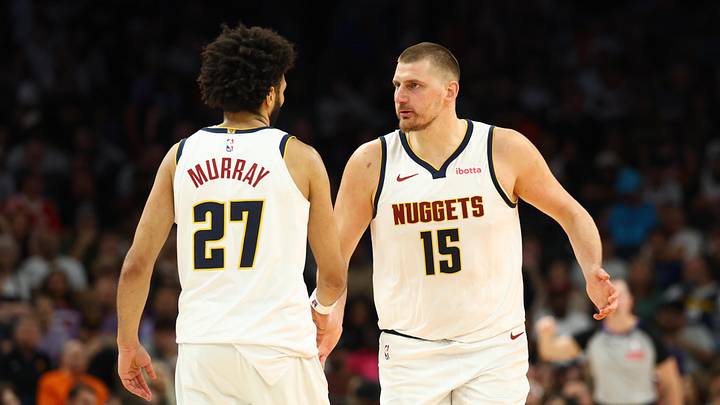 Mar 24, 2026; Phoenix, Arizona, USA; Denver Nuggets center Nikola Jokic (15) with guard Jamal Murray (27) against the Phoenix Suns in the second half at Mortgage Matchup Center. Mar 24, 2026; Phoenix, Arizona, USA; Denver Nuggets center Nikola Jokic (15) with guard Jamal Murray (27) against the Phoenix Suns in the second half at Mortgage Matchup Center.